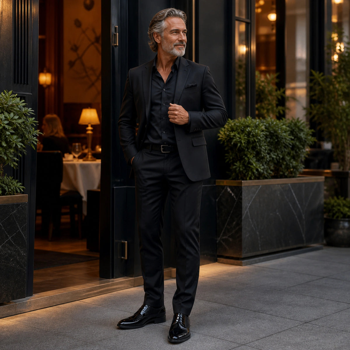 Mature man wearing black textured Oxford shoes outside an upscale restaurant — view 8
