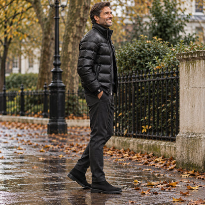 Side full length view of the Black garment worn by a happy adult model in cool UK autumn setting — view 3