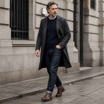 Mature man wearing dark brown lace up ankle boots in a heritage city — view 7