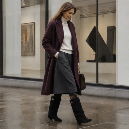 ankle boots — Mature woman wearing black fold over knee high boots outside an art gallery — view 7
