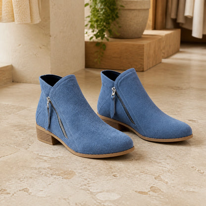 Dusty blue suede low heel diagonal zip ankle boots complete pair front view