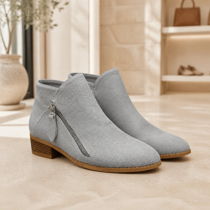 Light gray suede low heel diagonal zip ankle boots complete pair front view — view 3