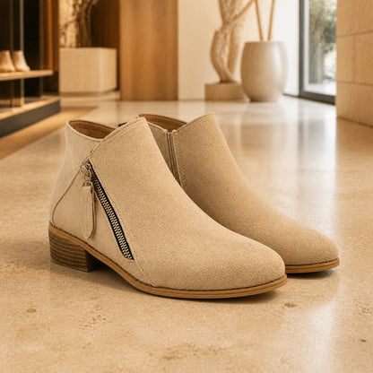Sand beige suede low heel diagonal zip ankle boots complete pair front view — view 5
