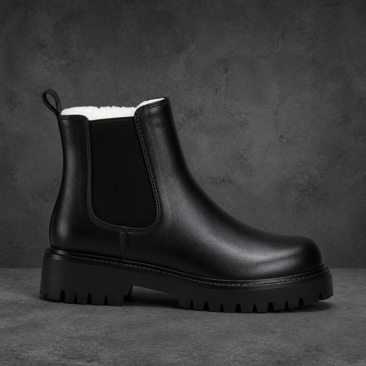ankle boots — Black fleece lined chunky Chelsea boot true side profile — view 2