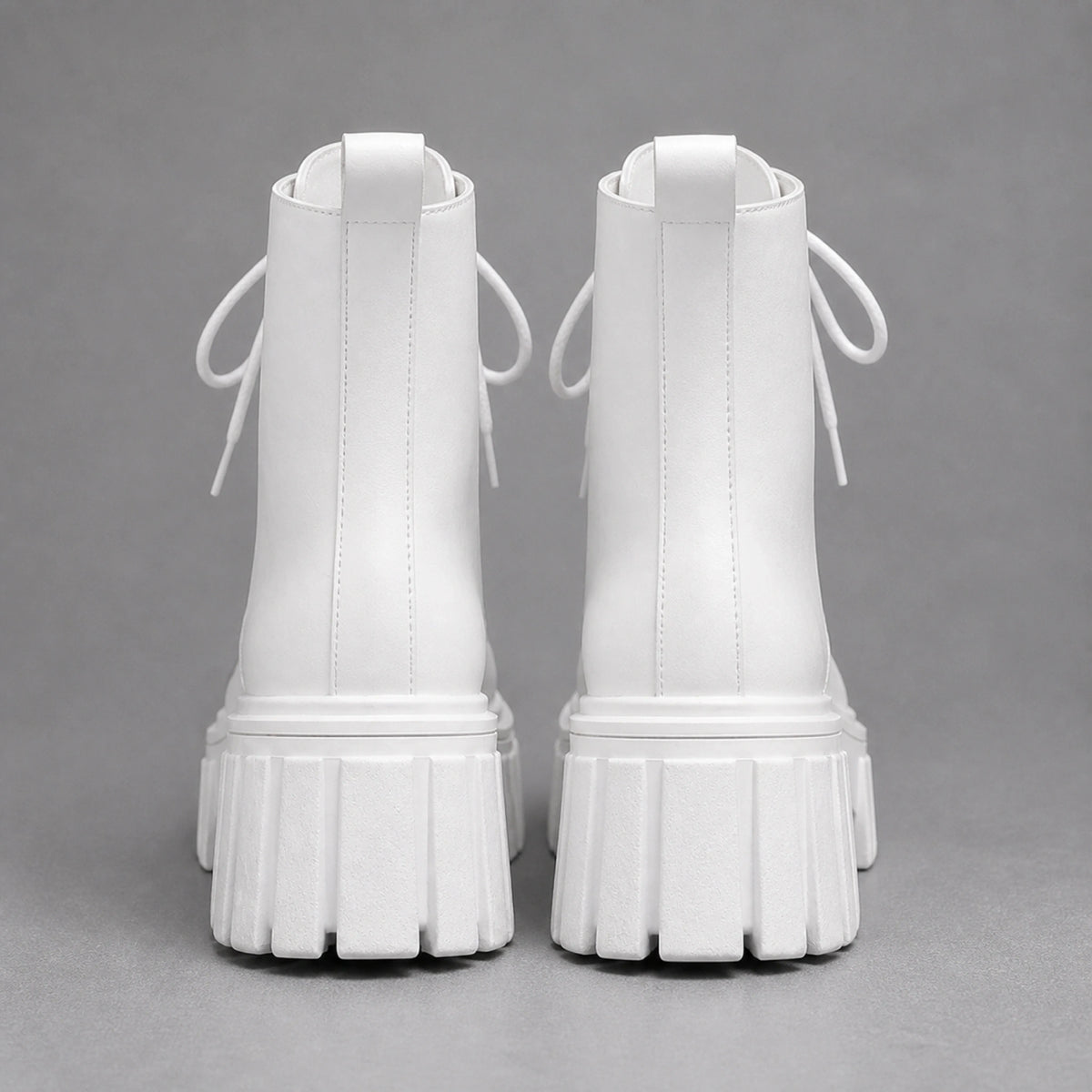 White chunky platform combat ankle boots direct rear view — view 4