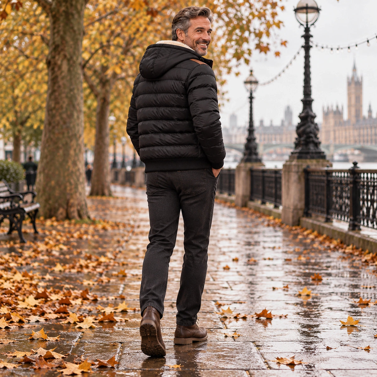 Back full length view of the Black garment worn by a happy adult model in cool UK autumn setting — view 4