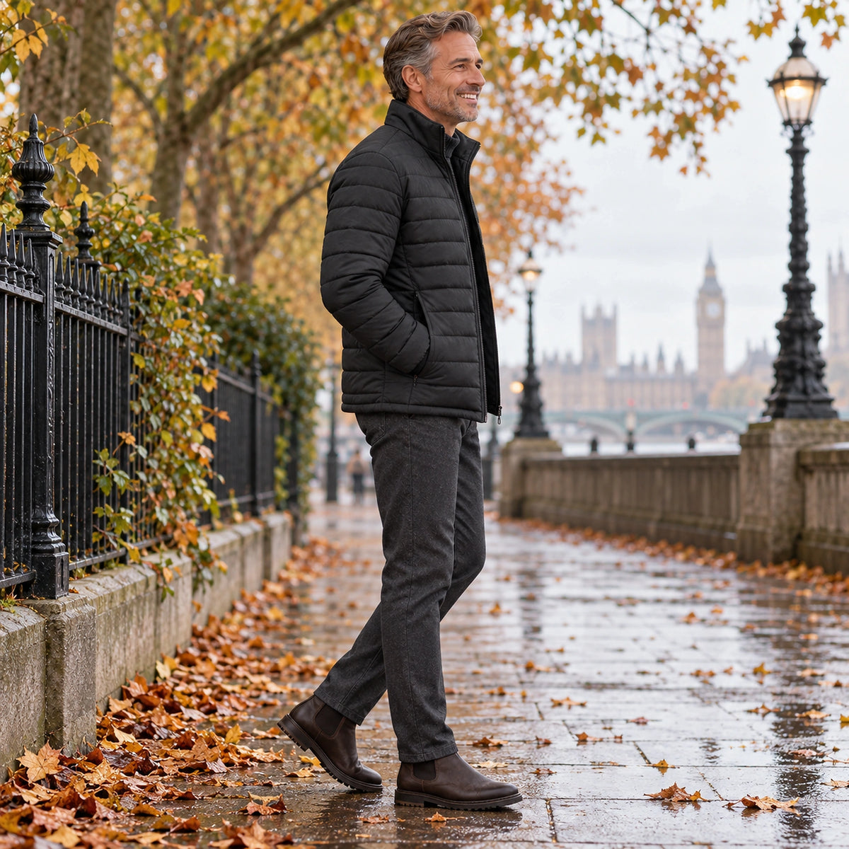 Side full length view of the Black garment worn by a happy adult model in cool UK autumn setting — view 7
