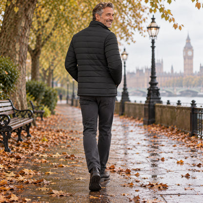 Back full length view of the Black garment worn by a happy adult model in cool UK autumn setting — view 8
