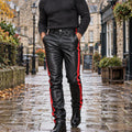 leather trousers — Front view of the full Red trousers worn by an adult model in a cool UK autumn street setting