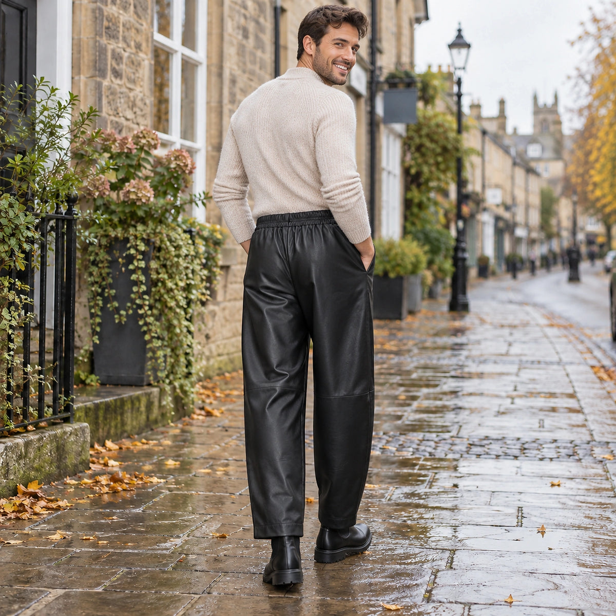 leather trousers — Back full length view of the Black garment worn by a happy adult model in cool UK autumn setting — view 8