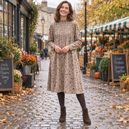 Women's A Line Knit Mid Calf Midi Jumper Dress in Khaki, worn by happy model UK autumn setting