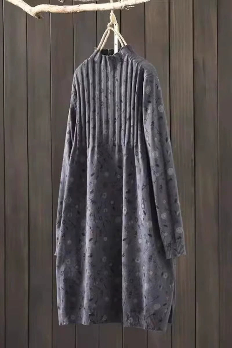 Grey knit midi jumper dress hanging against wooden background, showcasing ribbed texture and subtle pattern — view — view 10