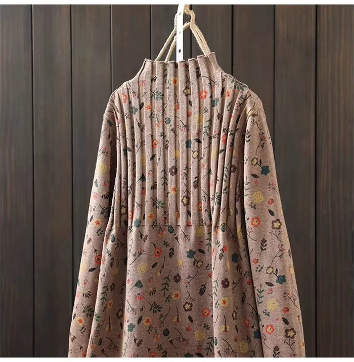 Floral patterned knit midi jumper dress with pleated design, hanging on wooden background — view 22 — view 26