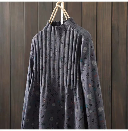 A Line knit midi jumper dress with pleated detail and floral pattern, hanging on wooden hanger — view 24 — view 28