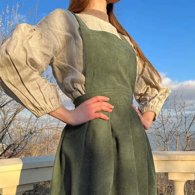 Green corduroy midi jumper dress with square neck and button details, outdoor view — 8 — view 13