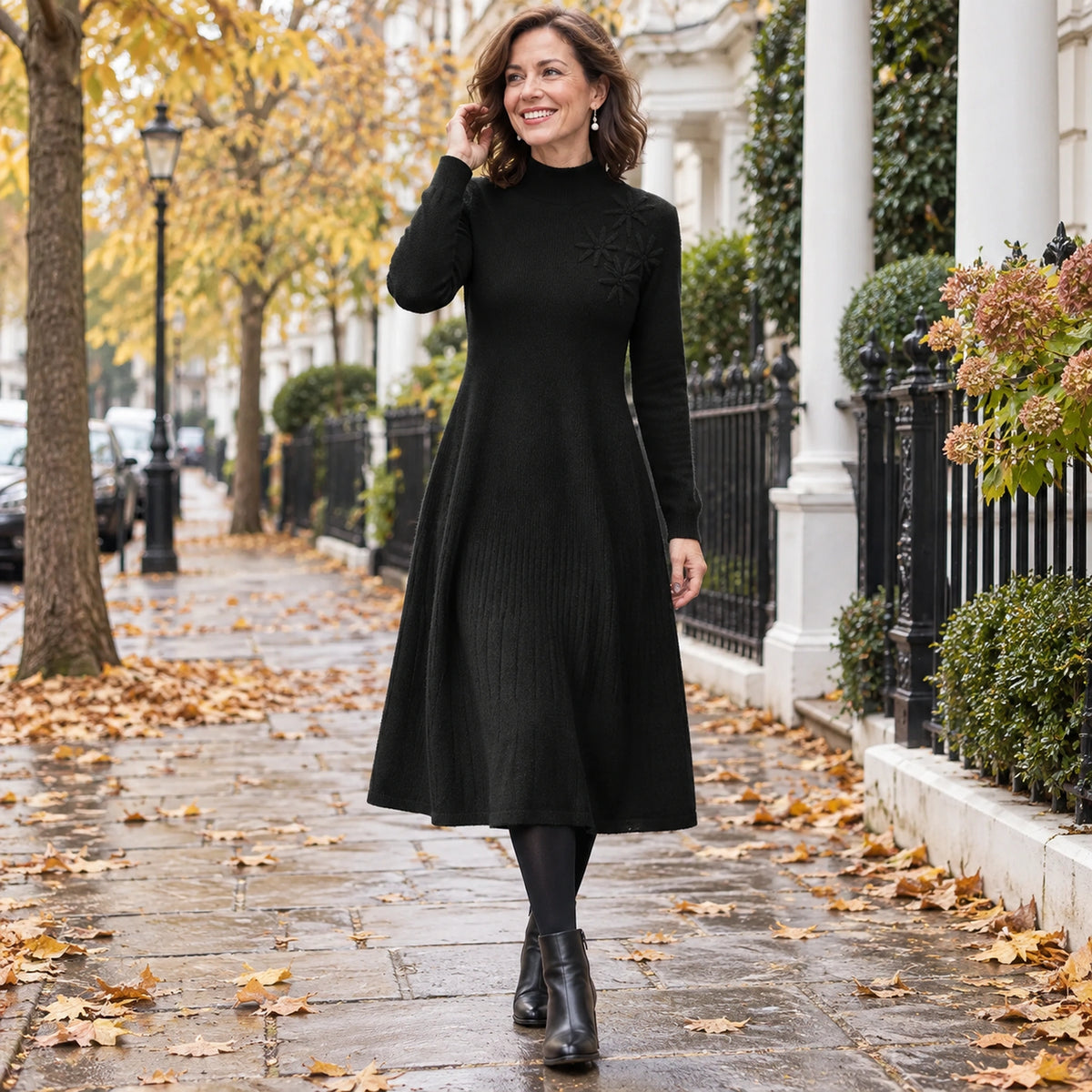 Women's Embroidered Turtleneck Wool Blend Midi Jumper Dress in Black, worn by a happy model UK autumn setting — view 4