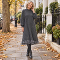 Women's Lace Trim Half High Collar Midi Jumper Dress in Grey, worn by a happy model UK autumn setting