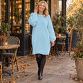Women's Long Sleeve Polyester Midi Jumper Dress in Sky Blue, worn by a happy model UK autumn setting