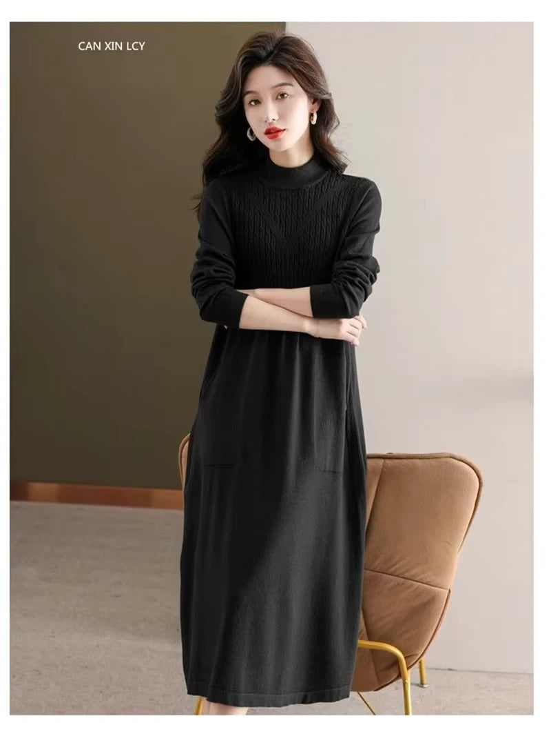 Black women's loose fit A line midi jumper dress with half high neck, worn indoors — view 29 — view 32