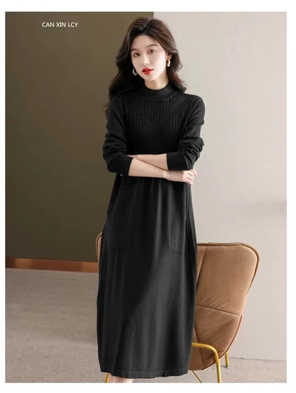 Black women's loose fit A line midi jumper dress with half high neck, worn indoors — view 29 — view 32
