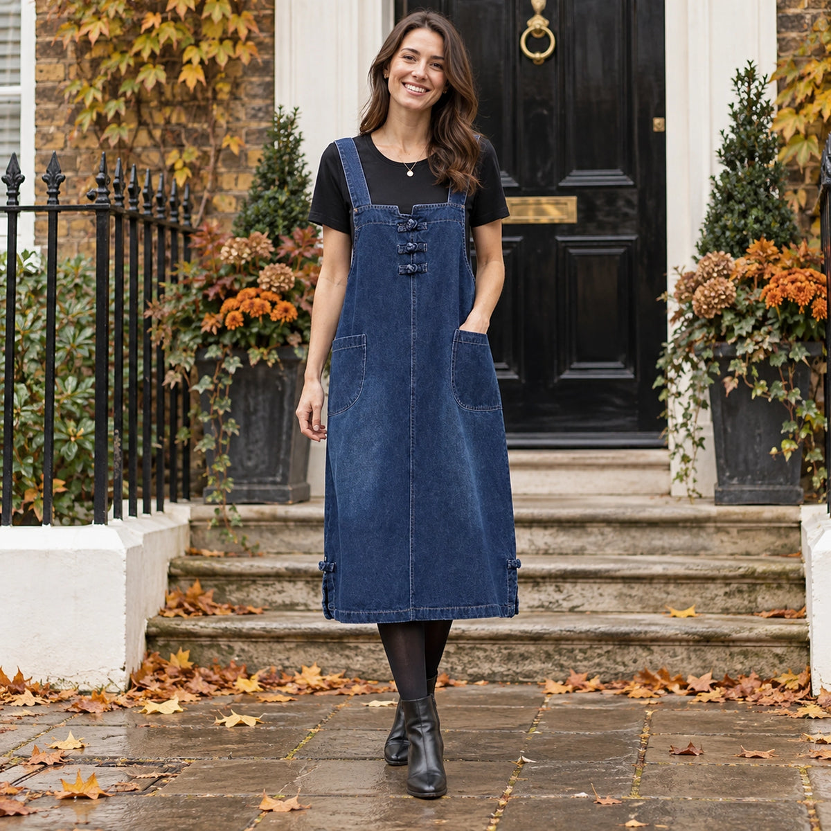 Women's Loose Fit Denim Knee Length Midi Jumper Dress in Dark Blue, worn by a happy model UK autumn setting
