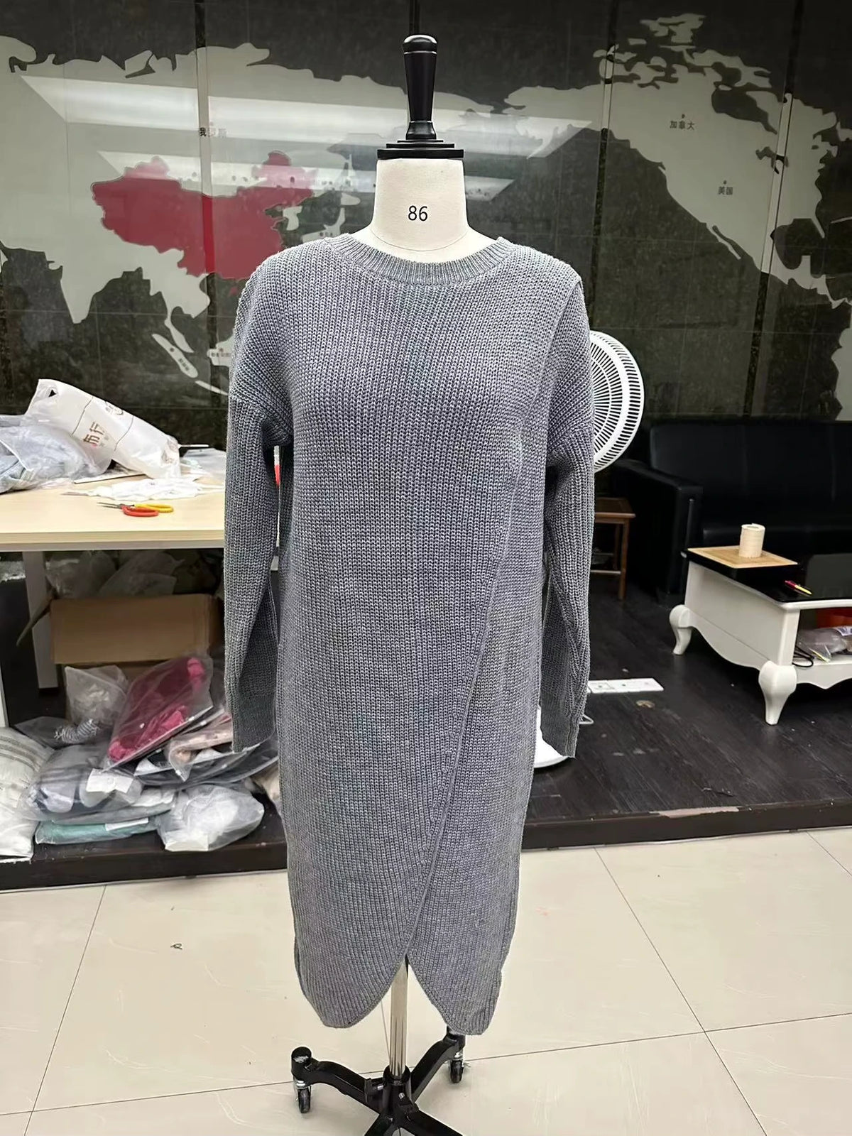 Gray knitted midi jumper dress with an O neck design on a mannequin in indoor setting — view 10 — view 13