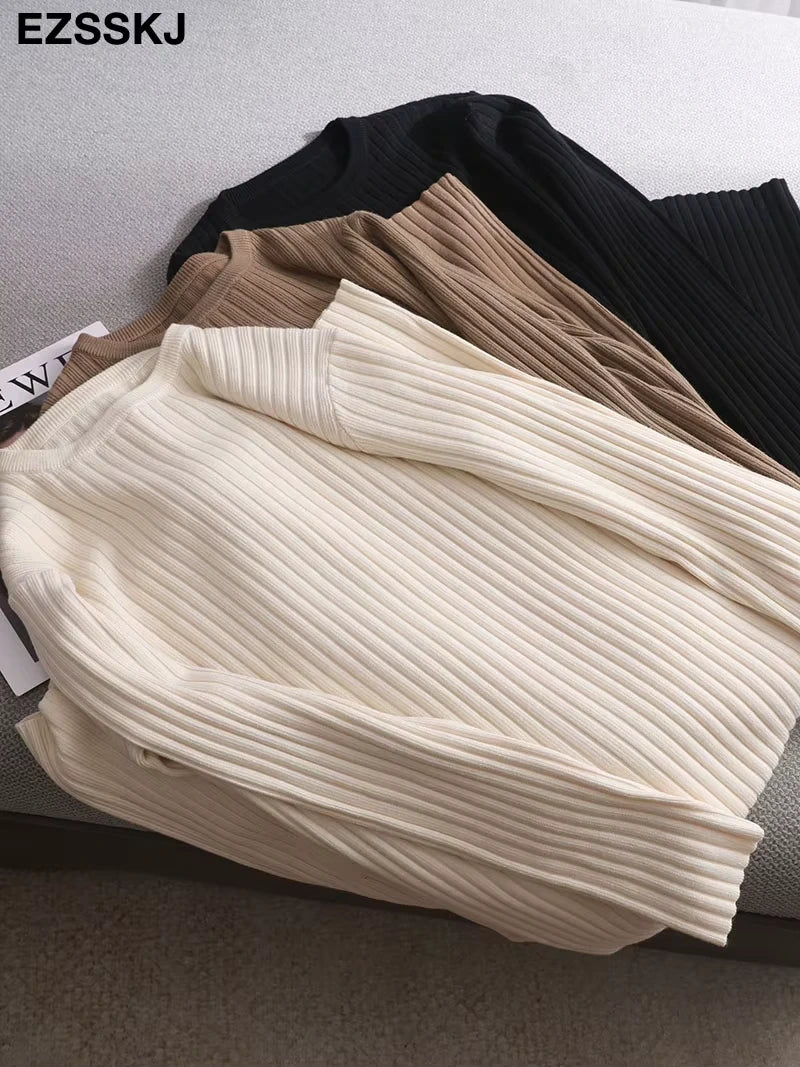 Midi jumper dress — Cream, tan, and black knit dresses folded on a sofa — view 5 — view 10