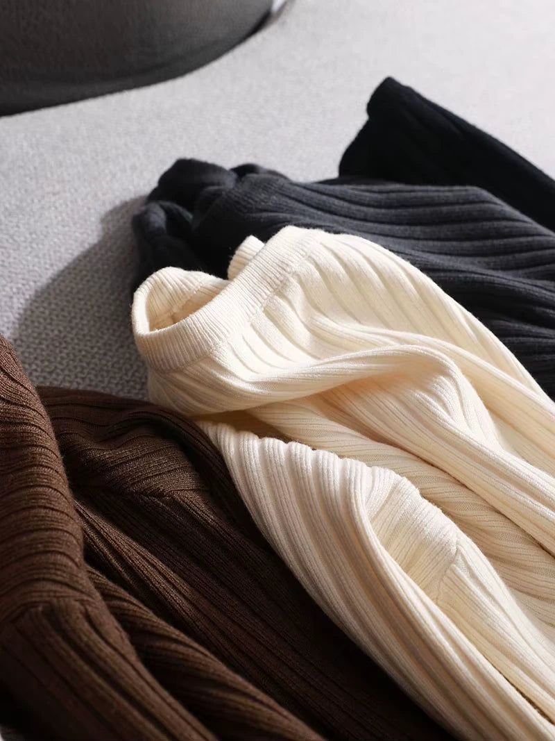 Cream, black, and brown knit midi jumper dress with ribbed texture, laid flat — view 18 — view 23