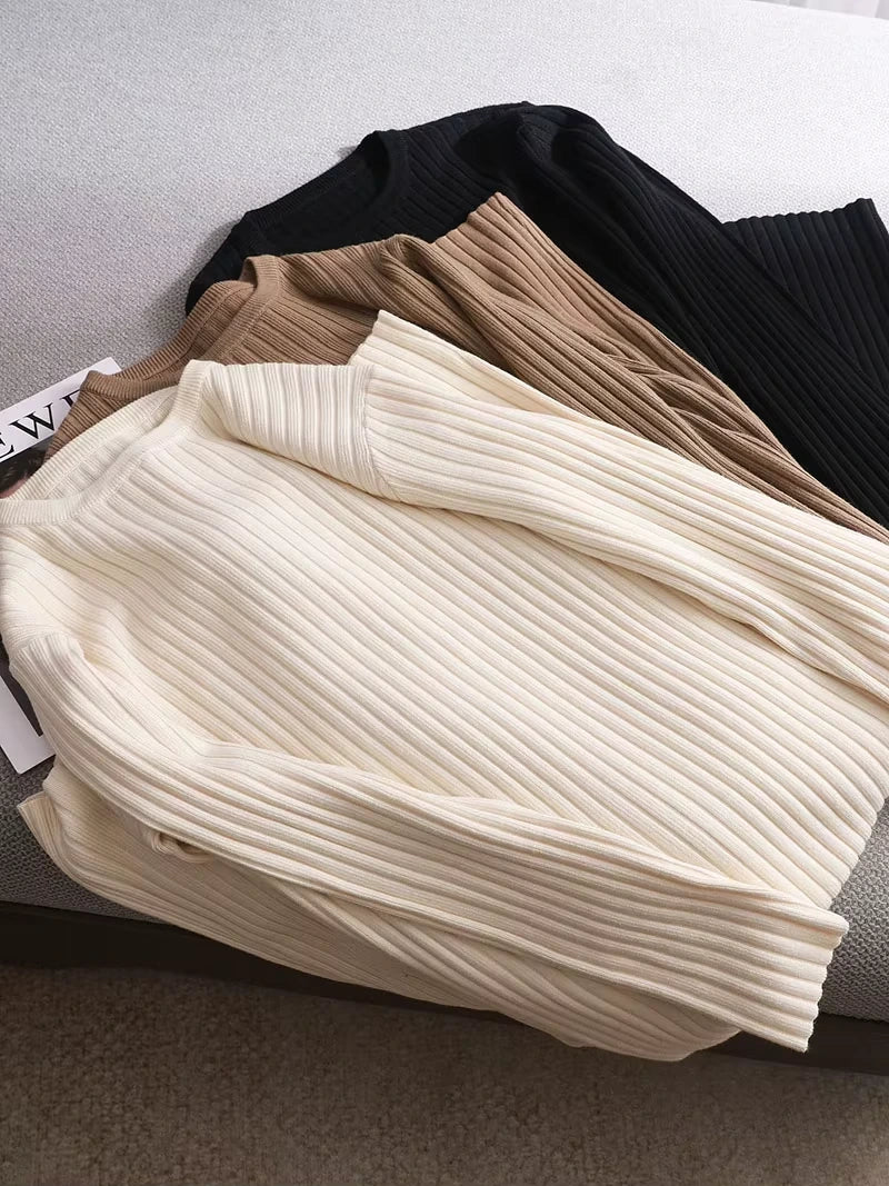 Midi jumper dress — Cream, brown, and black ribbed knit dresses folded on a sofa — view 19 — view 24