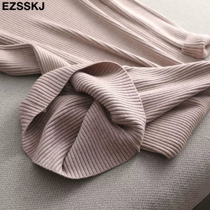 Light pink ribbed knit fabric of a women's midi jumper dress, close up view — 27 — view 32