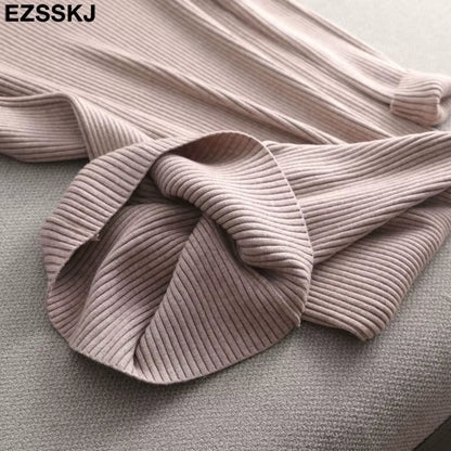 Light pink ribbed knit fabric of a women's midi jumper dress, close up view — 27 — view 32
