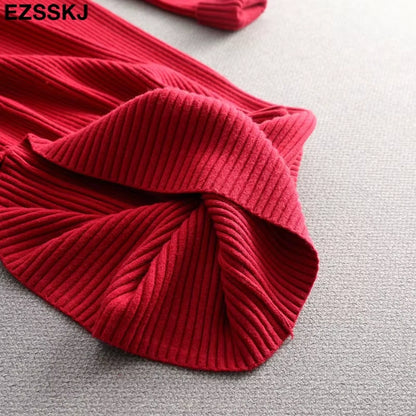 Red ribbed knit fabric of a women's midi jumper dress, showing texture and detail — view 31 — view 36
