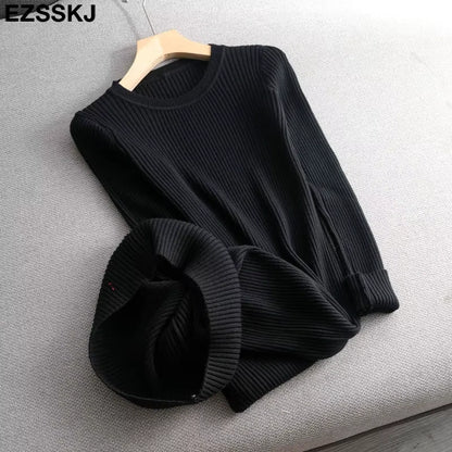 Black ribbed knit midi jumper dress with O neck and slim fit design, laid flat on a sofa — view 34 — view 39