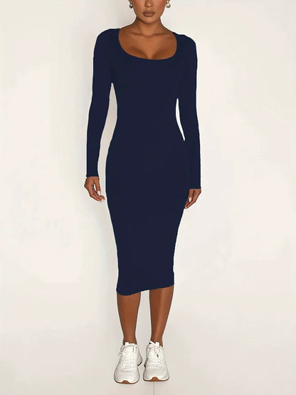 Woman wearing a navy blue square neck long sleeve midi jumper dress, front view — 9 — view 11