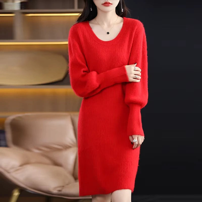 Red knit midi jumper dress with lantern sleeves, knee length, displayed in a cosy room setting — view 5 — view 10