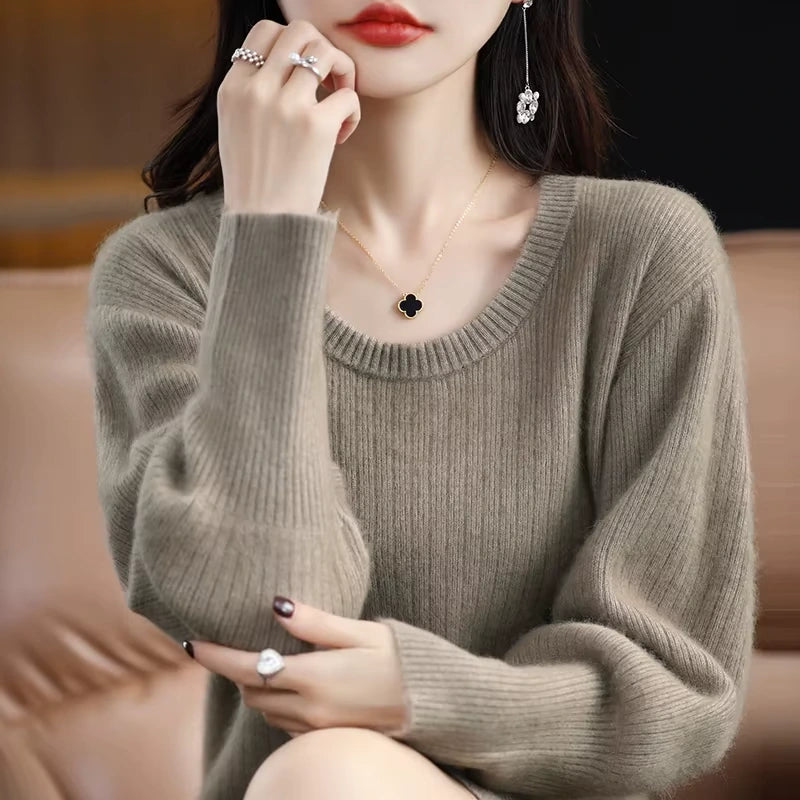Woman wearing a striped knit lantern sleeve midi jumper dress, sitting on sofa — view 6 — view 11