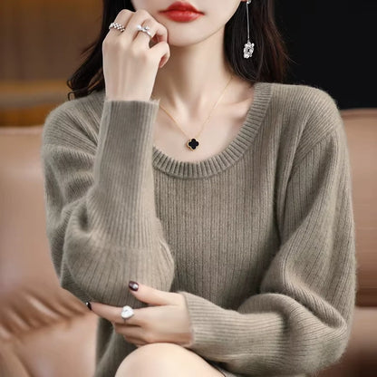 Woman wearing a striped knit lantern sleeve midi jumper dress, sitting on sofa — view 6 — view 11