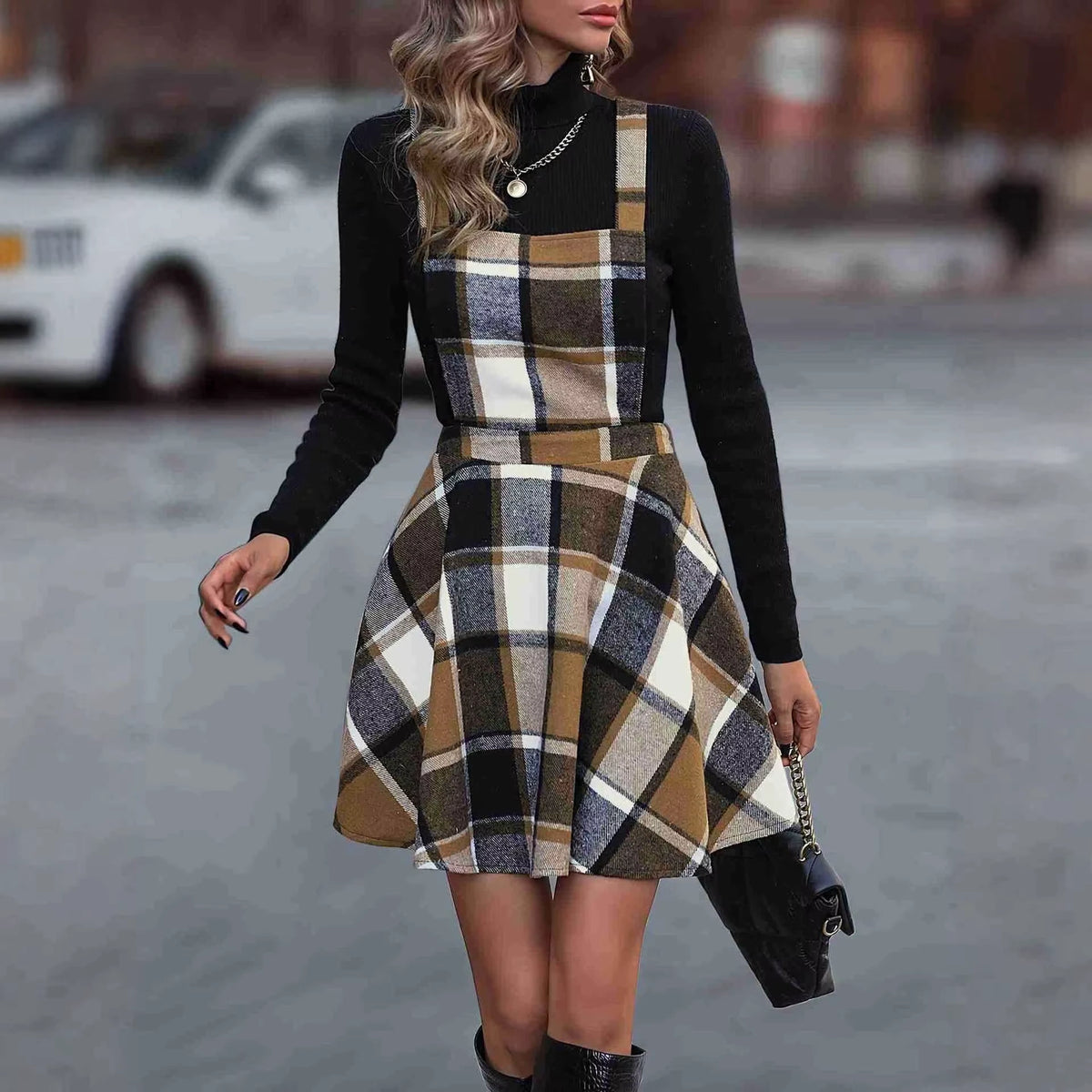 Women's tartan A line knee length midi jumper dress with plaid pattern, worn black top — view 2