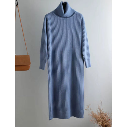 A blue turtleneck midi jumper dress with straight knit design hanging on wall — view 10 — view 15