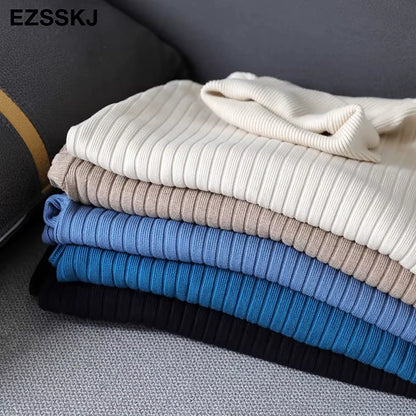 Midi jumper dress — Stack of folded turtleneck straight knit dresses in various colours on a sofa — view 16 — view 21
