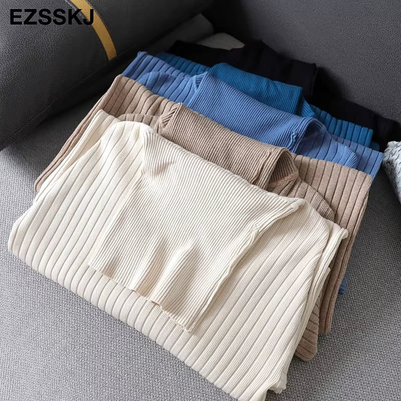 Midi jumper dress — Folded women's turtleneck dresses in beige, blue, and brown, displayed on a sofa — view 18 — view 23