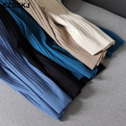 Multiple colours of ribbed knit fabric for women's turtleneck midi jumper dress, folded on a grey surface — view 21 — view 26
