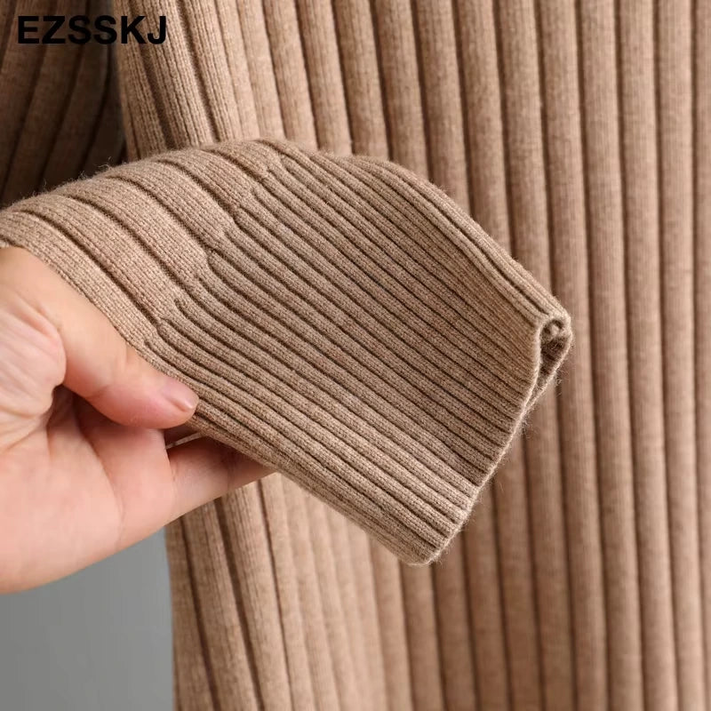 Close up of beige straight knit fabric on a women's turtleneck midi jumper dress — view 29 — view 34