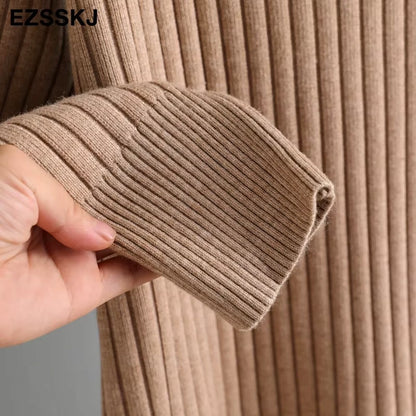 Close up of beige straight knit fabric on a women's turtleneck midi jumper dress — view 29 — view 34