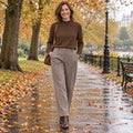 Women's V Neck Velvet Midi Jumper Dress in Brown Basic, worn by a happy model UK autumn setting