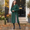 Womens Loose Fit Knitted Midi Jumper Dress in Dark Green, worn by a happy model UK autumn setting