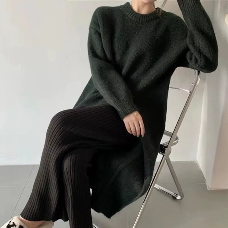 Loose fit knitted midi jumper dress in dark colour, seated view on chair — 14 — view 18