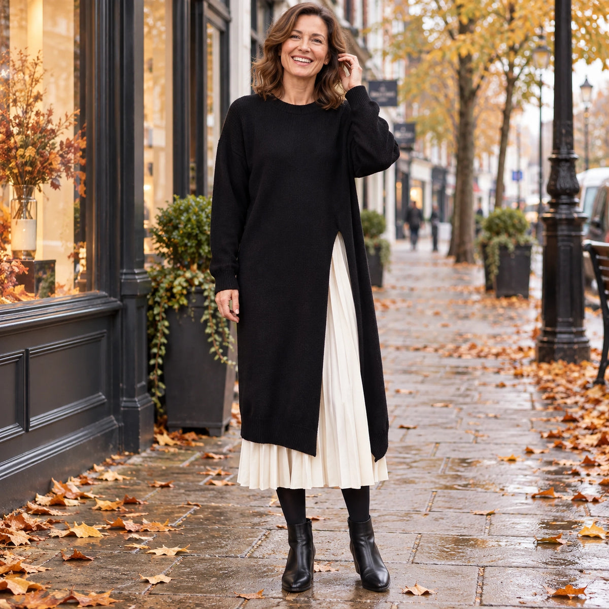 Womens Loose Fit Knitted Midi Jumper Dress in Black, worn by a happy model UK autumn setting — view 2