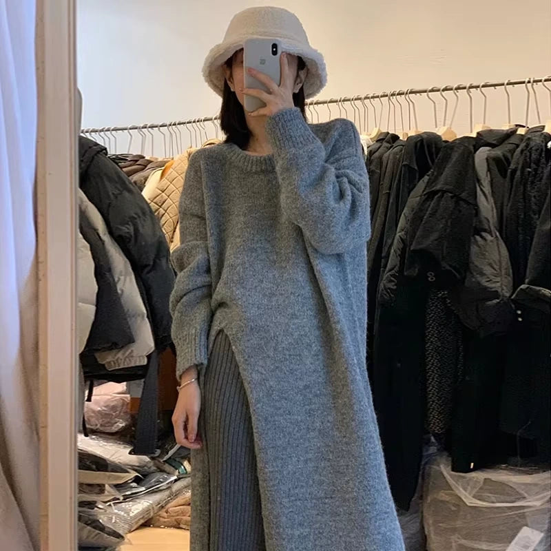 Grey loose fit knitted midi jumper dress hanging on a rack in clothing store — view 2 — view 6