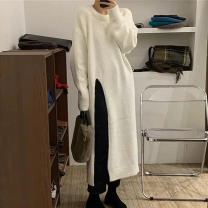 White loose fit knitted midi jumper dress with side slit, displayed in a room setting — view 5 — view 9